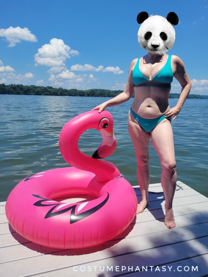 Panda girl in a bikini poses with her flamingo inflatable