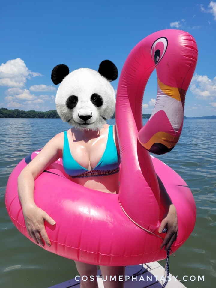 Panda girl wearing an inflatable pink flamingo tube