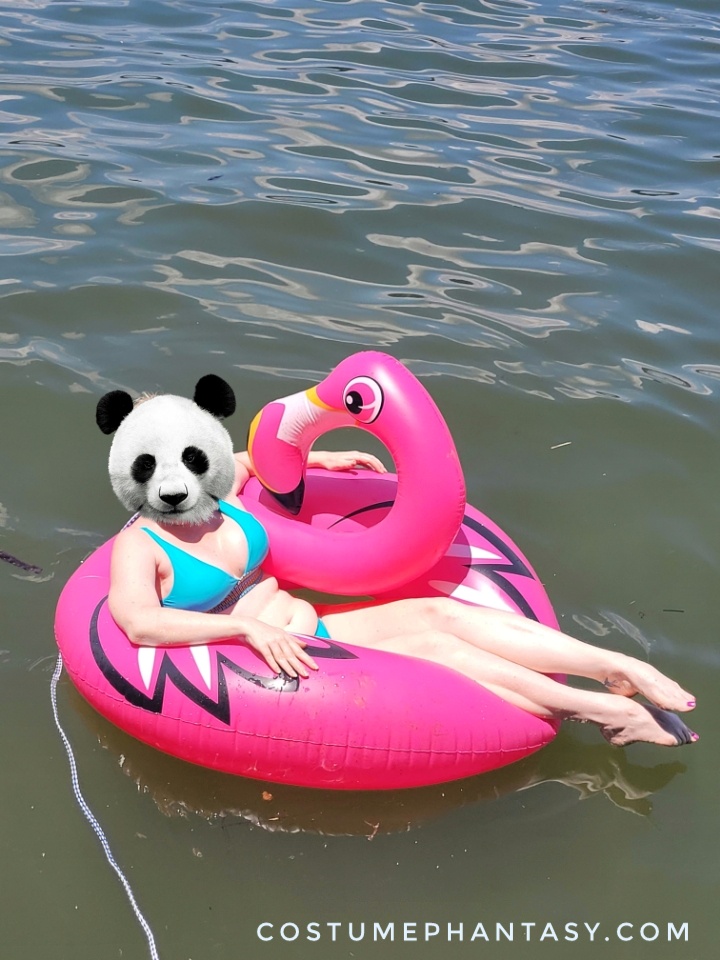 Bikini girl floats in the lake on a pink flamingo tube