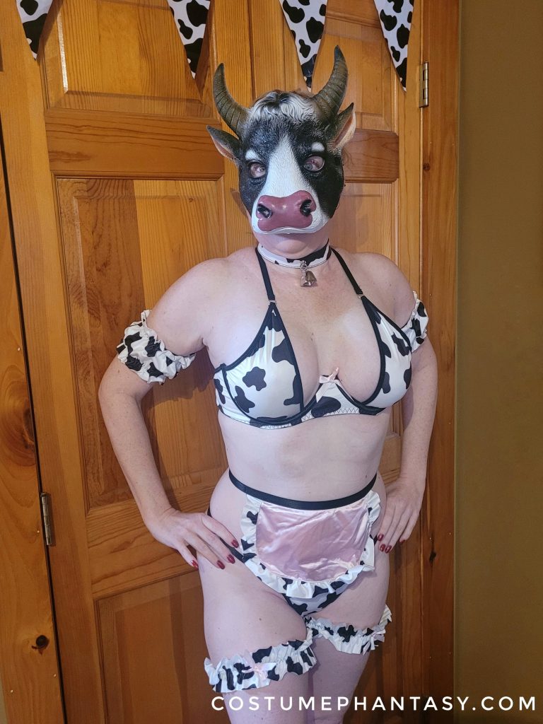 Girl in sexy cow costume and mask